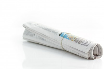 rolled newspaper